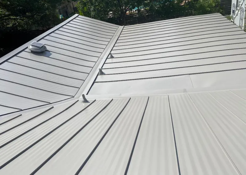 Solar attic fan installed on a metal roof for Roof Ventilation in South Hill